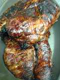 Pork brisket on the grill with semi- dry rub