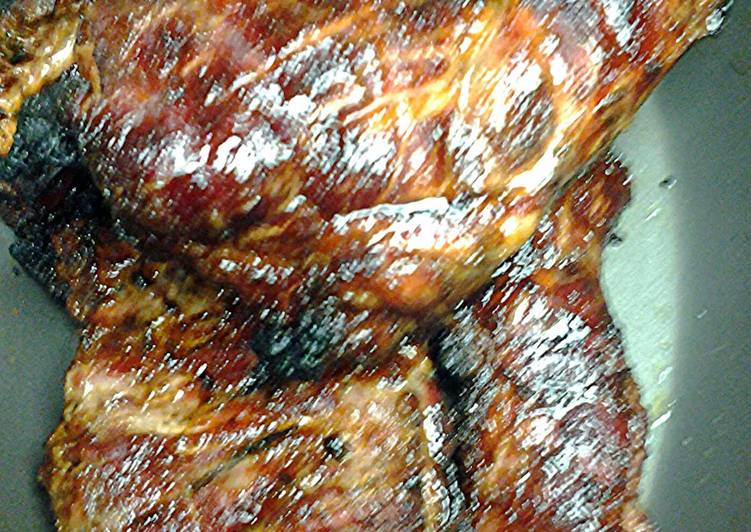 Pork brisket on the grill with semi- dry rub Pork brisket on the grill with semi- dry rub
