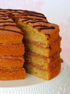 A picture of Coffee and Orange cake.