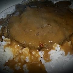 A picture of Hamburger on white rice with creamy mushroom gravy!.
