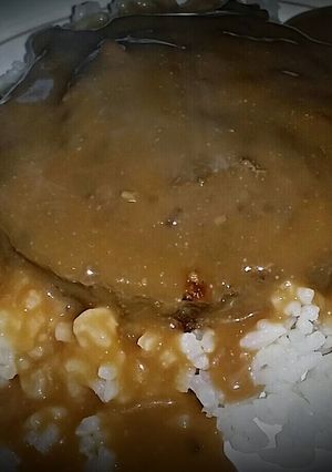 A picture of Hamburger on white rice with creamy mushroom gravy!.