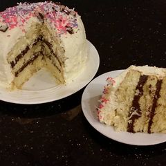 Vanilla Layer Cake with Whipped Chocolate Ganache Filling and Whipped Coconut Cream Frosting A picture of Vanilla Layer Cake with Whipped Chocolate Ganache Filling and Whipped Coconut Cream Frosting.