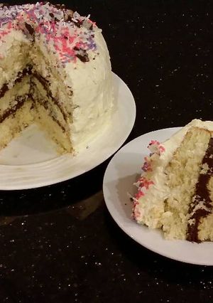 A picture of Vanilla Layer Cake with Whipped Chocolate Ganache Filling and Whipped Coconut Cream Frosting.