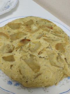 Una foto de Tortilla de patata y trufa negra