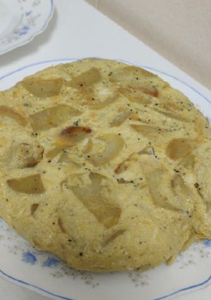 Una foto de Tortilla de patata y trufa negra