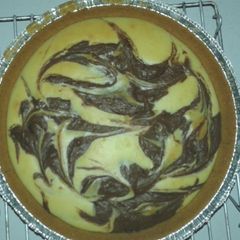 A picture of Vanilla-Chocolate Swirl Hazelnut Cheesecake.