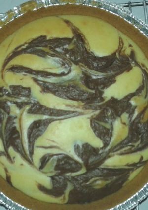 A picture of Vanilla-Chocolate Swirl Hazelnut Cheesecake.