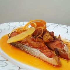 A picture of Salmon With Orange And Dried Apricot In Spicy Butter Sauce.
