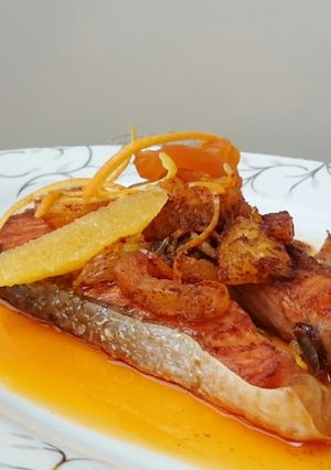 A picture of Salmon With Orange And Dried Apricot In Spicy Butter Sauce.