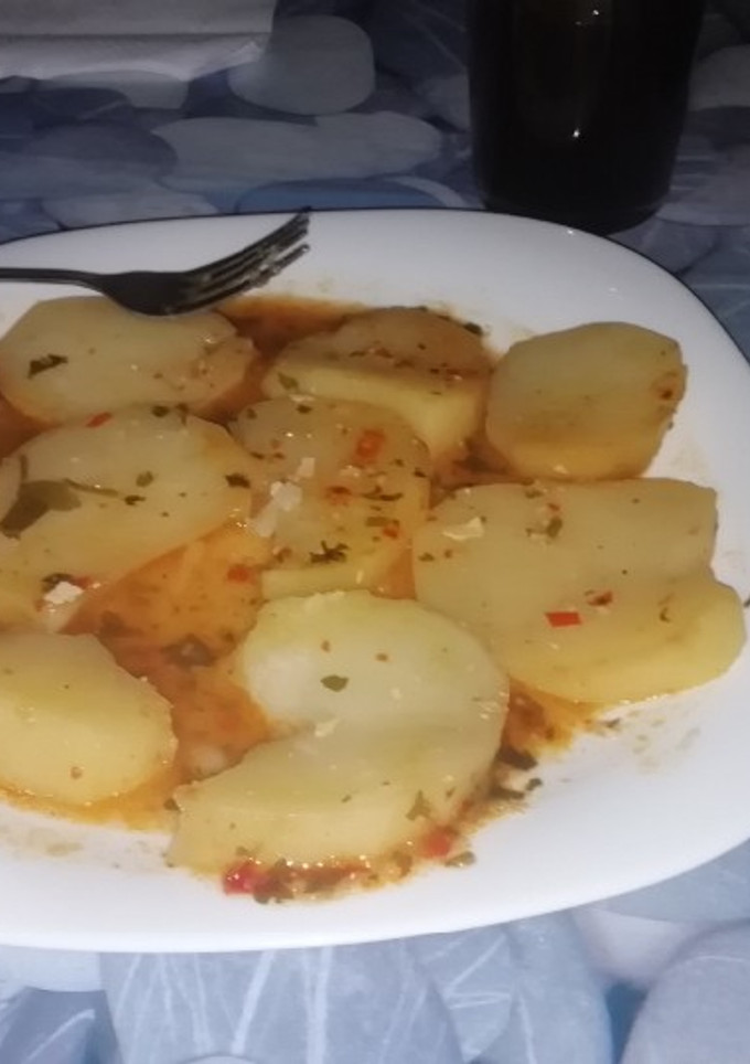 Una foto de Patatas al horno con chimichurri
