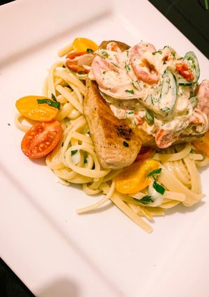 A picture of Yellow fin tuna with chilli & mozzarella linguini.