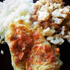 A picture of Roasted cauliflower and fish dinner..