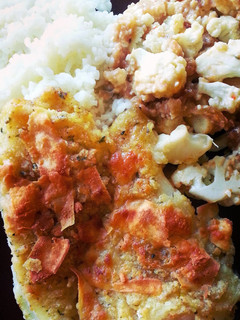 A picture of Roasted cauliflower and fish dinner..