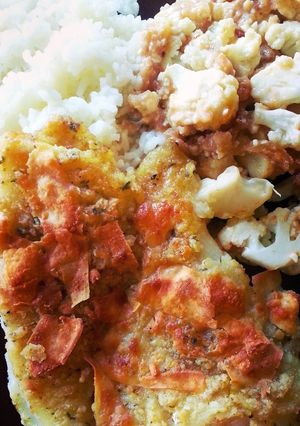 A picture of Roasted cauliflower and fish dinner..