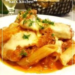 A picture of Chicken Simmered in Tomato Sauce with Cheese and Penne.