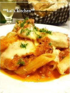 A picture of Chicken Simmered in Tomato Sauce with Cheese and Penne.