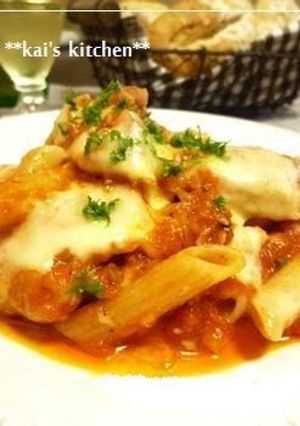 A picture of Chicken Simmered in Tomato Sauce with Cheese and Penne.
