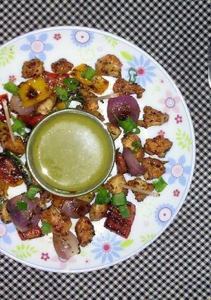 A picture of Chicken and Veggies stir fry.