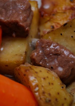 A picture of Stew Beef & Gravy w/Herb Roasted Potatoes.
