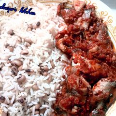 A picture of Rice and beans with stew.