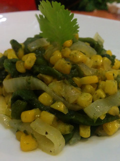 A picture of Corn and rajas (pepper strips).