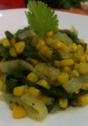 A picture of Corn and rajas (pepper strips).