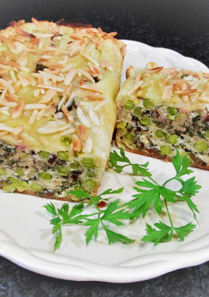 Una foto de Terrina de guisantes con hojas de remolacha para llevar