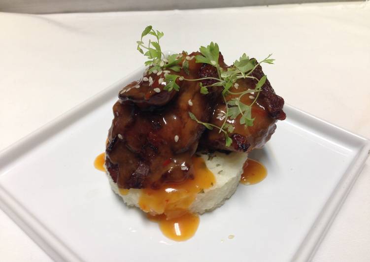 Recipes for crispy pig cheeks with spicy pineapple,orange glaze and thai basil,lemon rice