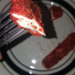 A picture of Hot cheeto mozzarella sticks (CheezOs).