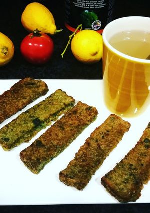 Una foto de Barritas de pan de semillas Rustik Bakery en manta verde