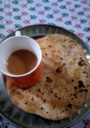 A picture of Tea and Paratha.