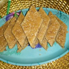 A picture of Sesame seeds and besan katli (til besan ki karli).