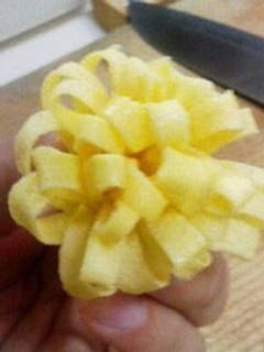 A picture of Omelette Crepe Flower Decoration for Character Bento.