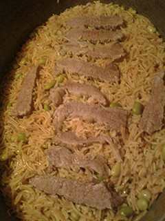 A picture of Basmati rice in beef stock.