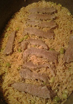 A picture of Basmati rice in beef stock.