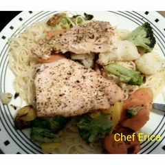 A picture of Baked fish with vegetable pasta.