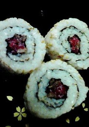 A picture of Sushi Rolls with Lightly Seared Beef.