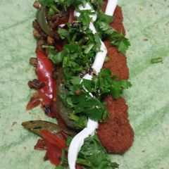 A picture of Vegetarian buffalo wings spinach wrap.