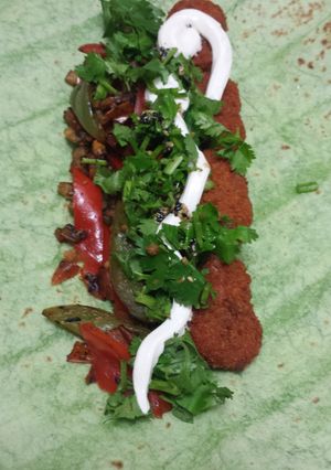 A picture of Vegetarian buffalo wings spinach wrap.