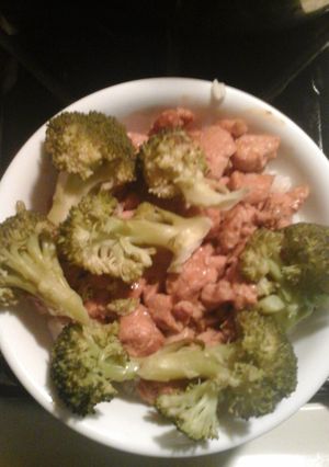 A picture of Steamed broccoli and terryaki chicken.
