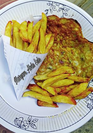 A picture of French fries and Fried Egg (Breakfast treat 2)🍟.