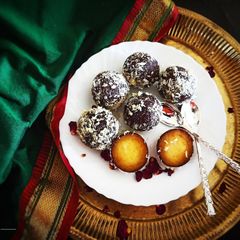 A picture of Dry Kala Jamuns with coconut cream filling.
