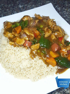 A picture of Couscous with chicken, sausage & veggie sauce.