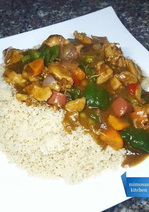 A picture of Couscous with chicken, sausage & veggie sauce.