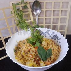 A picture of Mixed Veggies in Cooked Rice.