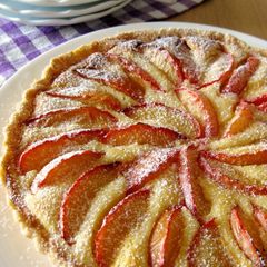 A picture of Almond Cheese Tart with Plums.