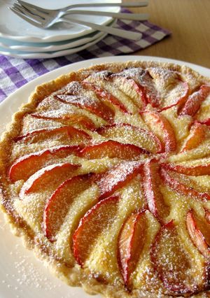 A picture of Almond Cheese Tart with Plums.