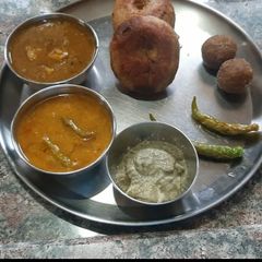 A picture of Dal bati in pressure cooker or kadhai.