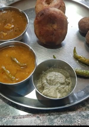 A picture of Dal bati in pressure cooker or kadhai.