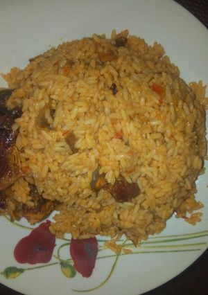 A picture of Jollof rice with fish.